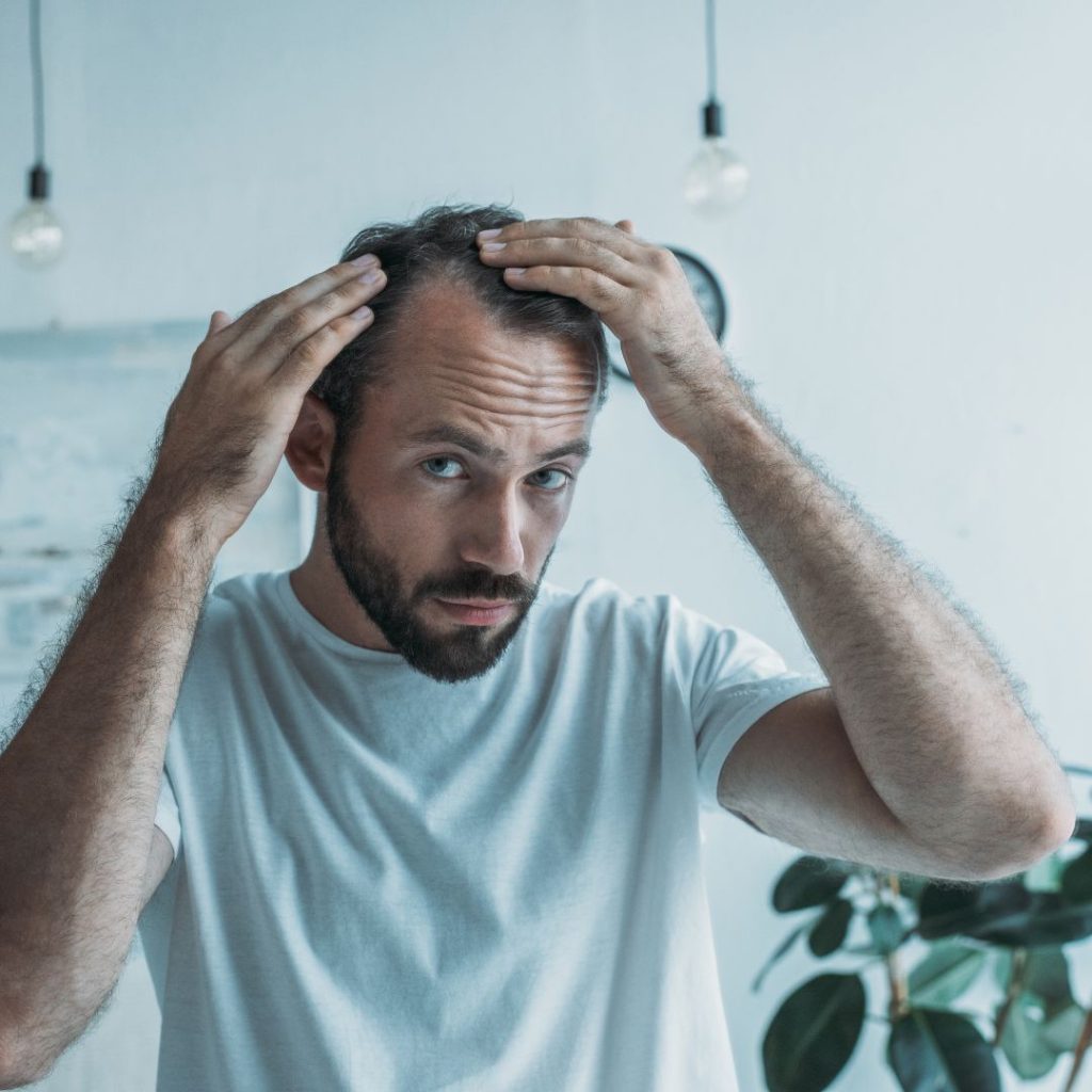 a man with Weak Hair Follicles taking a Hair PRP treatment at facelit